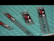 Creative Grids CGR112 one by twelve inch long rectangle acrylic quilt ruler showing black and white grid markers.