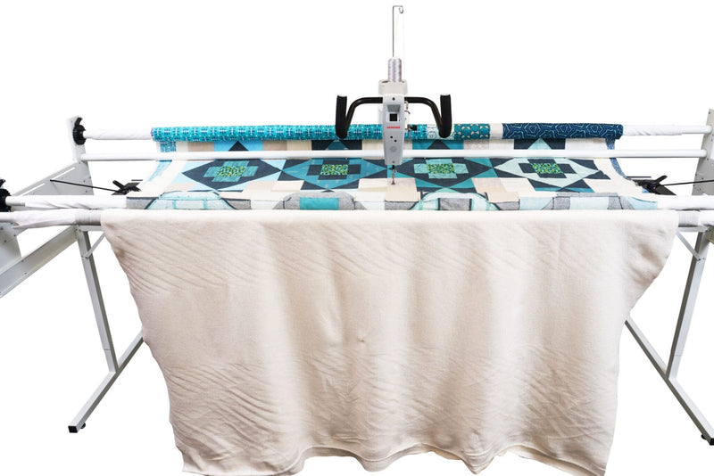 Janome Quilt Maker 15 compact longarm quilting machine head highlighting the LCD monitor and ergonomic handlebars.