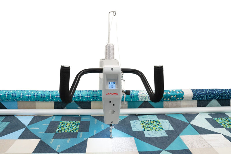 Janome Quilt Maker 15 compact longarm quilting machine head highlighting the LCD monitor and ergonomic handlebars.