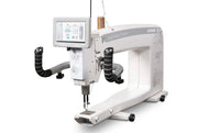 Janome Quilt Maker Pro 20 longarm quilting machine head highlighting the LCD touchscreen and digital tension.