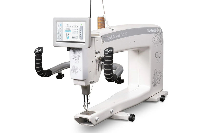 Janome Quilt Maker Pro 20 longarm quilting machine head highlighting the LCD touchscreen and digital tension.