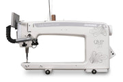 Janome Quilt Maker Pro 20 longarm quilting machine head highlighting the LCD touchscreen and digital tension.
