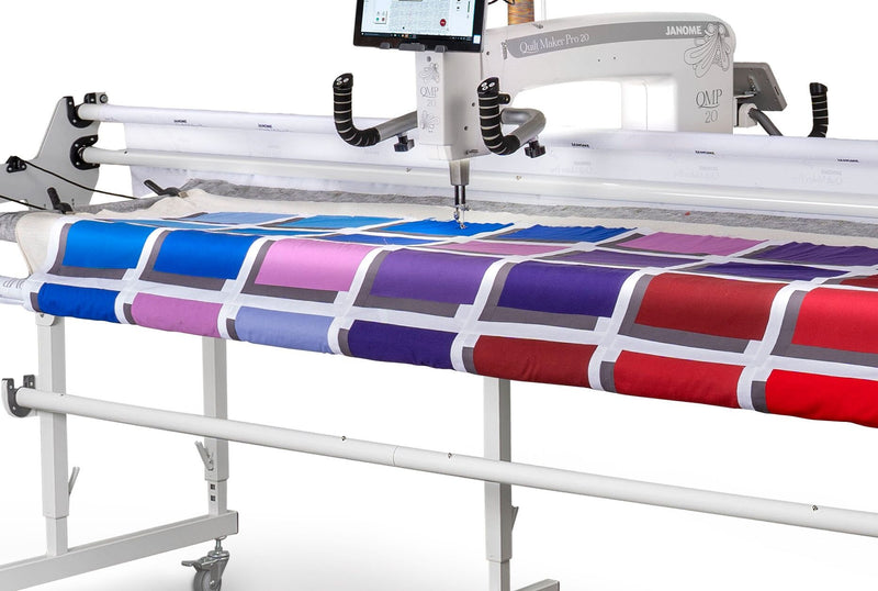 Janome Quilt Maker Pro 20 longarm quilting machine head highlighting the LCD touchscreen and digital tension.