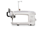 Janome Quilt Maker Pro 20 longarm quilting machine head highlighting the LCD touchscreen and digital tension.