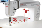 Janome Quilt Maker Pro 20 Versa ST sit-down longarm set into the electronic lift table.