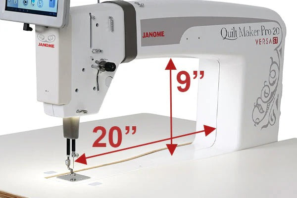 Janome Quilt Maker Pro 20 Versa ST sit-down longarm set into the electronic lift table.