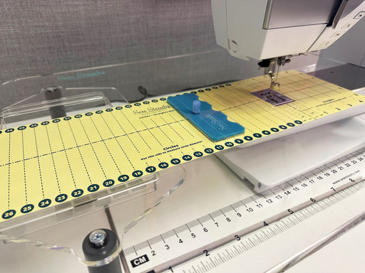 Large Deluxe 2.0 Universal Circles and Straights Tool with Mat in use; sewing machine not included