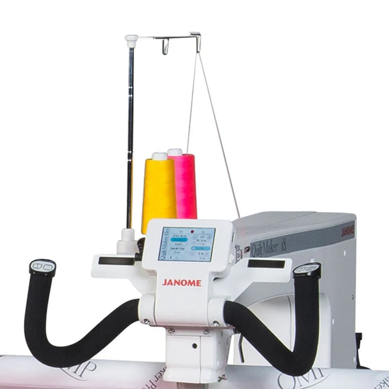 Janome Quilt Maker 18 longarm quilting machine head highlighting the ergonomic handles and LCD touchscreen display.